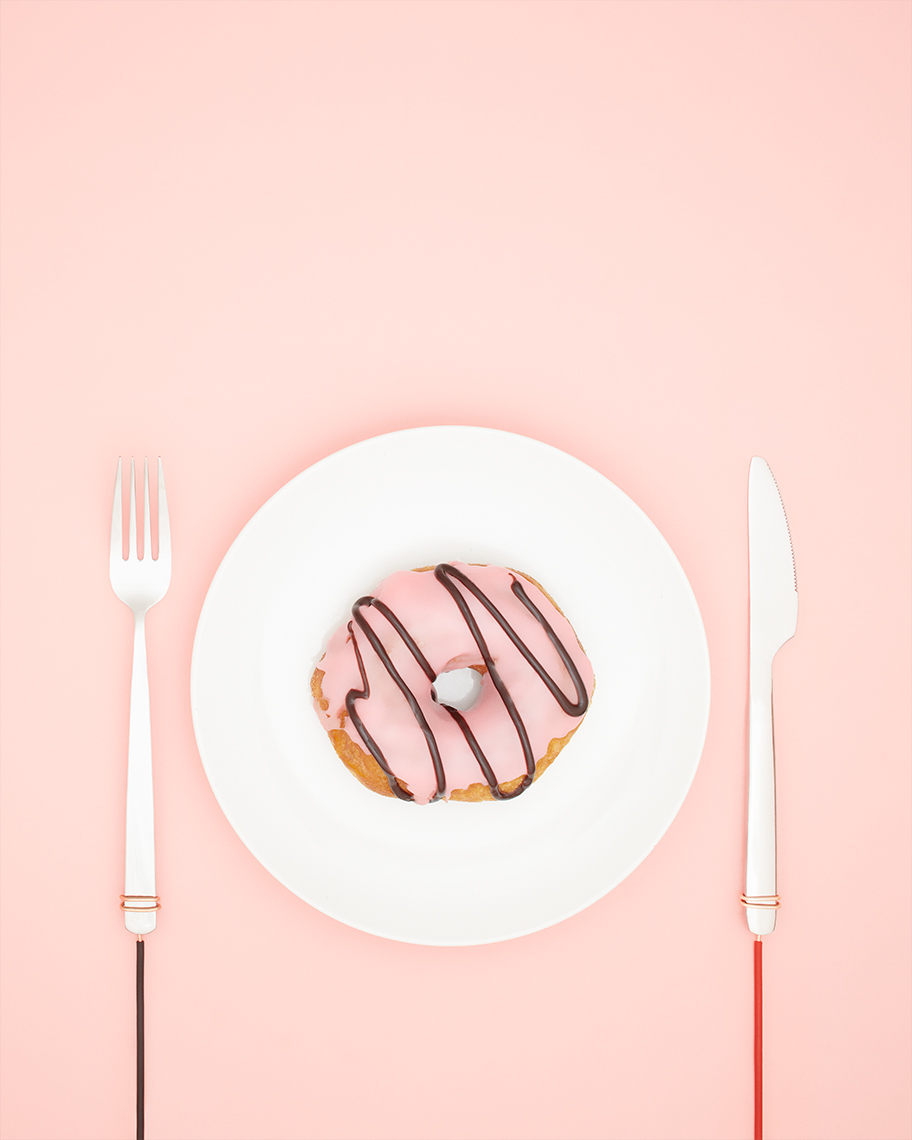 A potential electrified donut on a pink background
