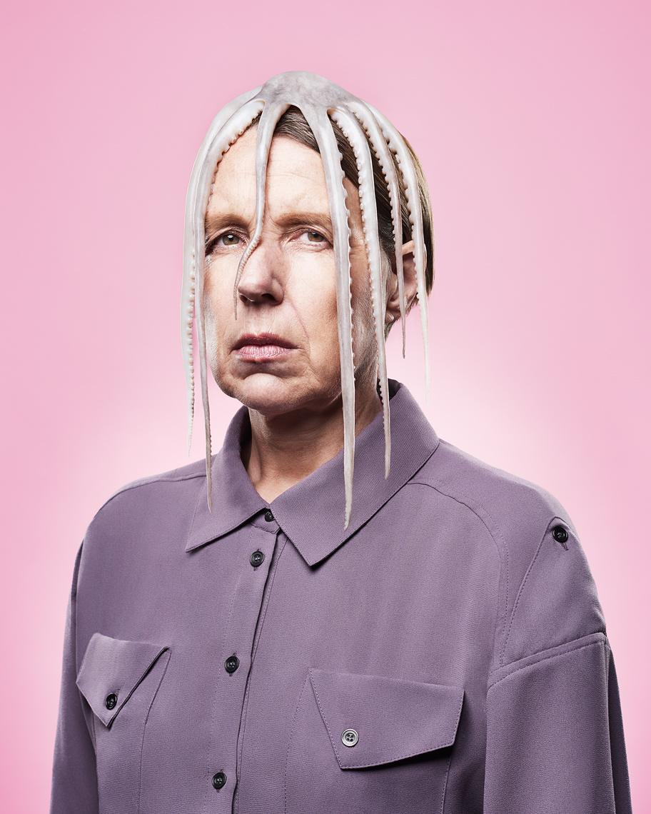 Portrait Photography of woman with an octopus stuck on her head